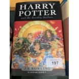 A FIRST EDITION COPY OF 'HARRY POTTER AND THE DEATHLY HALLOWS' BY J K ROWLING