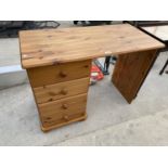 A PINE DESK WITH FOUR DRAWERS