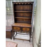 AN EARLY 20TH CENTURY OAK DRESSER WITH PLATE RACK, ON BARLEYTWIST LEGS, 36" WIDE