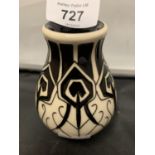 A MOORCROFT PEACOCK PARADE BLACK AND WHITE VASE