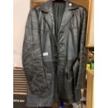 A BLACK LEATHER BELTED COAT