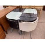 AN ART DECO STYLE GLASS TOP TABLE AND FOUR CHAIRS UPHOLSTERED IN BLACK AND WHITE VINYL ON SPLAY FEET