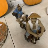 A GROUP OF THREE VINTAGE CHINESE POTTERY MUDMEN FIGURES