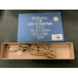 A COLLECTION OF COINAGE OF GREAT BRITAIN AND NORTHERN IRELAND 1977 AND A PEARL TYPE NECKLACE