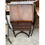 AN EARLY 20TH CENTURY BUREAU ON OPEN BASE