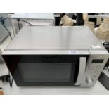 A KENWOOD 800W MICROWAVE BELIEVED TO BE IN WORKING ORDER BUT NO WARRANTY