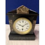A POLISHED SLATE AND MARBLE VICTORIAN MANTLE CLOCK WITH BRASS DETAIL AND KEY