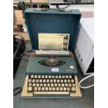 AN IMPERIAL 220 TYPEWRITER TO INCLUDE THE CASE