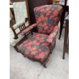 A LOW VICTORIAN MAHOGANY FRAMED NURSING CHAIR