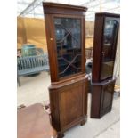 A MAHOGANY CORNER CABINET