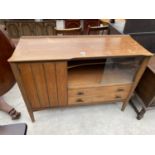 A VINTAGE LEBUS 'LINK' TEAK SIDEBOARD ENCLOSING A CUPBOARD, TWO DRAWERS AND GLASS SLIDE (ONE