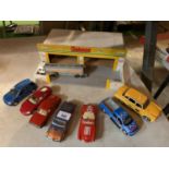 A WOODEN MODEL GARAGE TO INCLUDE SEVERAL TOY CARS