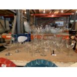 A DARTINGTON GLASS HAND CUT FUCHIA VASE, A JUG AND GROUP OF WINE GLASSES