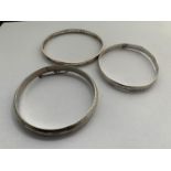 THREE SILVER BANGLES TWO STAMPED 925 AND ONE HALLMARKED