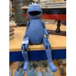 A MOVEABLE WOODEN SESAME STREET 'COOKIE' SHELF PUPPET