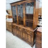 A REGENCY STYLE BEVAN FUNNELL THREE DOOR GLAZED BOOKCASE WITH CUPBOARDS AND DRAWERS TO THE BASE, 59"