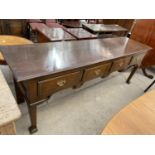 A GEORGE III OAK DRESSER BASE ENCLOSING FOUR DRAWERS, WITH BRASS HANDLES, 83" WIDE