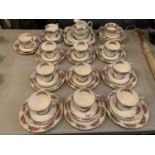 A TUSCAN BONE CHINA TEA SET TO INCLUDE ELEVEN TRIOS ETC