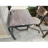 A MID 20TH CENTURY TUBULAR METAL FRAMED INTEGRAL CHILD'S DESK AND CHAIR