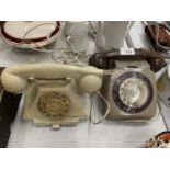 A RETRO DIAL TELEPHONE AND A REPORDUCTION PUSH BUTTON TELEPHONE