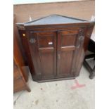 AN 18TH CENTURY OAK CORNER CUPBOARD WITH TWO PANELLED DOORS, 31" WIDE