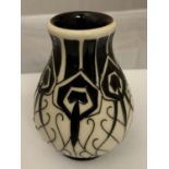 A MOORCROFT PEACOCK PARADE BLACK AND WHITE VASE