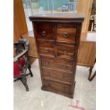 A MODERN HARDWOOD CHEST OF FOUR SHORT AND THREE LONG DRAWERS, 23" WIDE