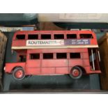 A METAL REPLICA MODEL OF A RED LONDON DOUBLE DECKER BUS