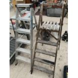 TWO SETS OF STEP LADDERS, ONE FOUR RUNG VINTAGE SET AND A SIX RUNG METAL STEP LADDER