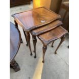 A NEST OF THREE MAHOGANY TABLES