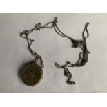 A WHITE METAL POSIBBLY SILVER CHAIN WITH A LOCKET STYLE PURSE IN THE FORM OF A COIN