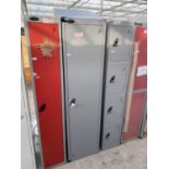 AN AS NEW GREY SINGLE LOCKER WITH KEYS