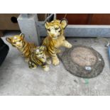 A CONCRETE BIRD BATH TOP AND THREE TIGER ORNAMENTS