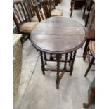 AN EARLY 20TH CENTURY OAK BARLEYTWIST GATELEG DINING TABLE