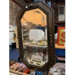 A VICTORIAN OAK EIGHT SIDED BEVELLED MIRROR
