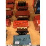A COLLECTION OF FOUR HORNBY MODEL TRAIN PASSENGER CARRIAGES