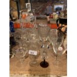 A DARTINGTON GLASS HAND CUT FUCHIA VASE, A JUG AND GROUP OF WINE GLASSES