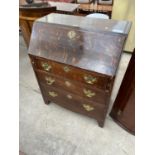 A GEORGE III STYLE OAK BUREAU WITH FITTED INTERIOR AND THREE GRADUATED DRAWERS, 30" WIDE
