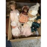SIX PORCELAIN HEADED DOLLS TO INCLUDE EMILY WEARING A BONNET AND TWO BABIES