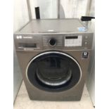 A SILVER SAMSUNG 9KG WASHING MACHINE BELIEVED TO BE IN WORKING ORDER BUT NO WARRANTY