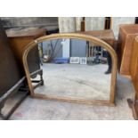 A 19TH CENTURY STYLE GILT COLOURED OVERMANTEL MIRROR WITH ARCHED TOP, 44" WIDE