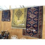 THREE PATTERNED RUGS