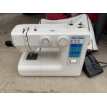 A NEW HOME ELECTRIC SEWING MACHINE WITH FOOT PEDAL - W/O