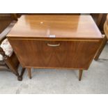 A VINTAGE WALNUT RECORD CABINET ON TAPERED LEGS, 28" WIDE