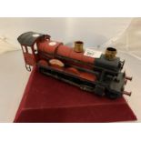 A RED TINPLATE MODEL OF A 'GREAT WESTERN RAILWAY' TRAIN