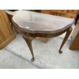 A WALNUT DEMI LUNE HALL TABLE