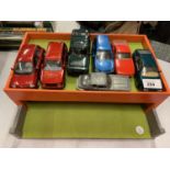 A WOODEN GARAGE WITH TOY CARS