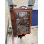 AN EDWARDIAN MAHOGANY AND INLAID ASTRAGAL GLAZED CORNER CUPBOARD