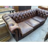 A MODERN BROWN CHESTERFIELD THREE SEATER SETTEE
