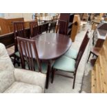 A MORRIS FURNITURE & CO EXTENDING DINING TABLE, SIX CHAIRS AND AN OPEN BOOKCASE